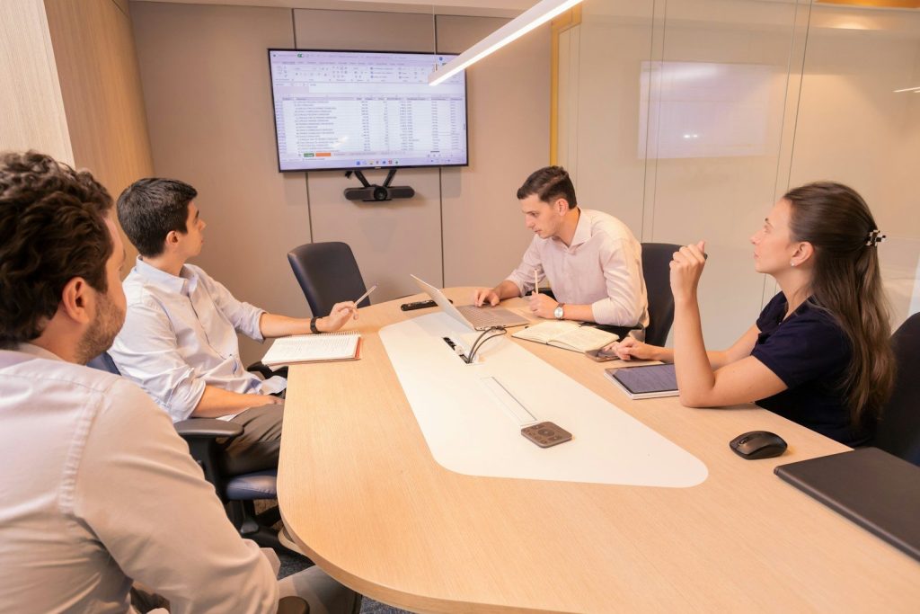 Business meeting with people around a conference table.