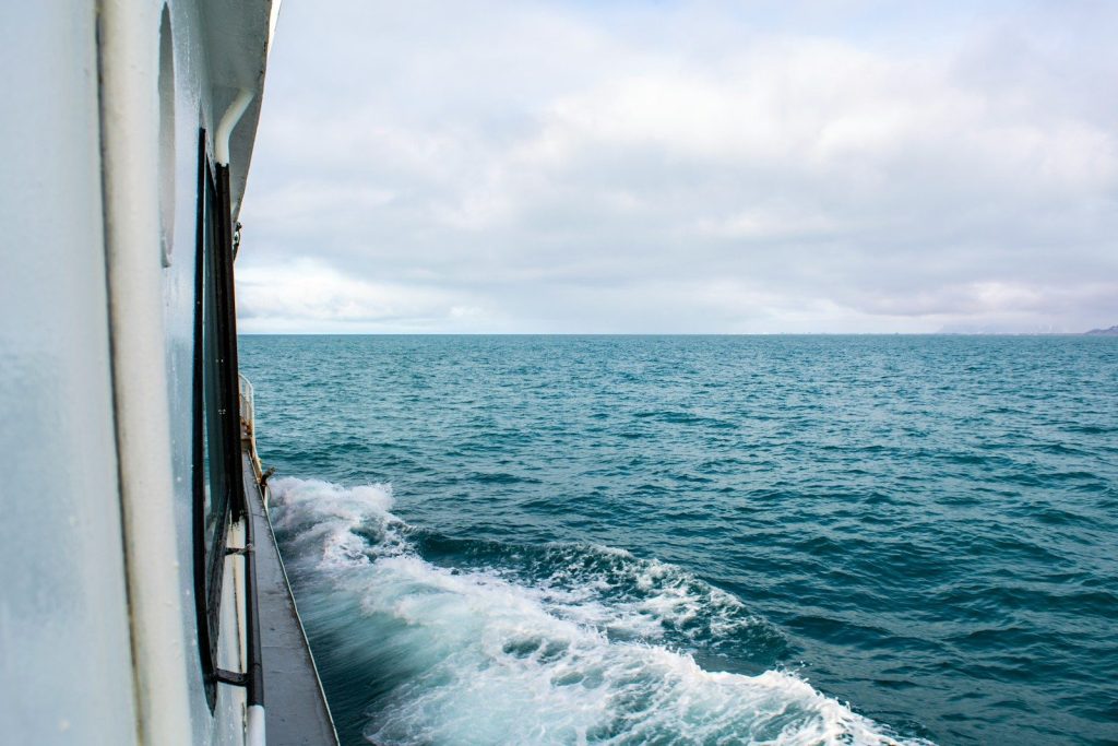 a boat traveling across a large body of water