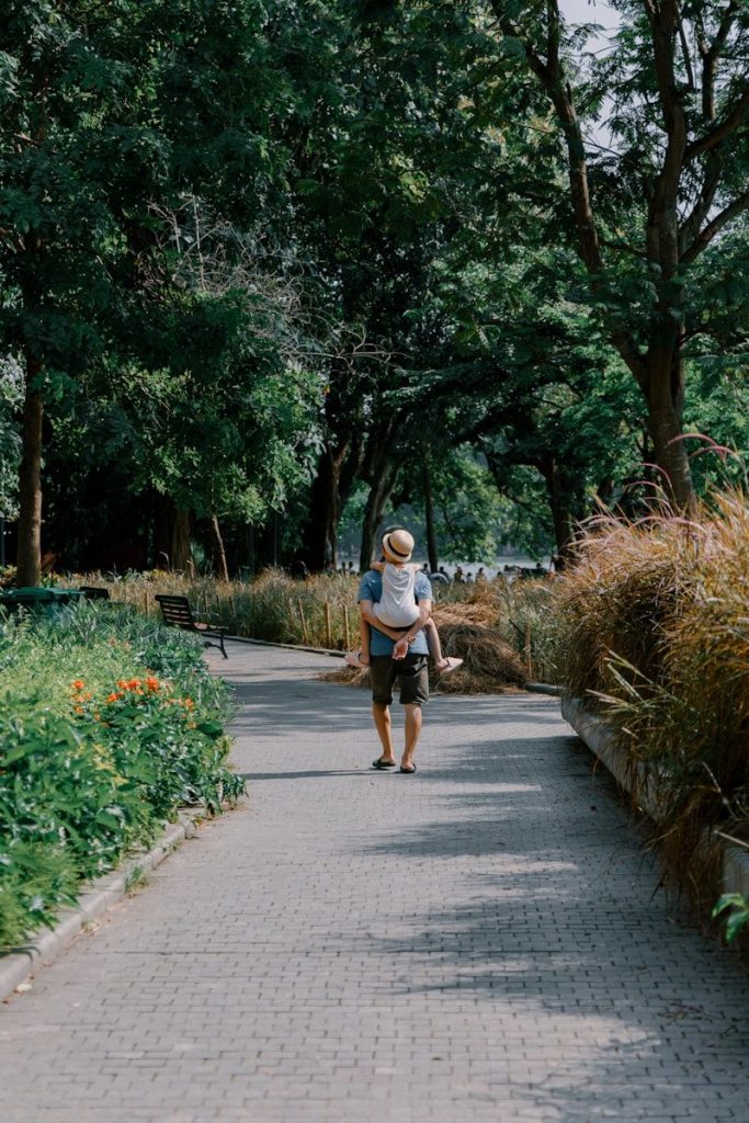 A person walking down a path in a park